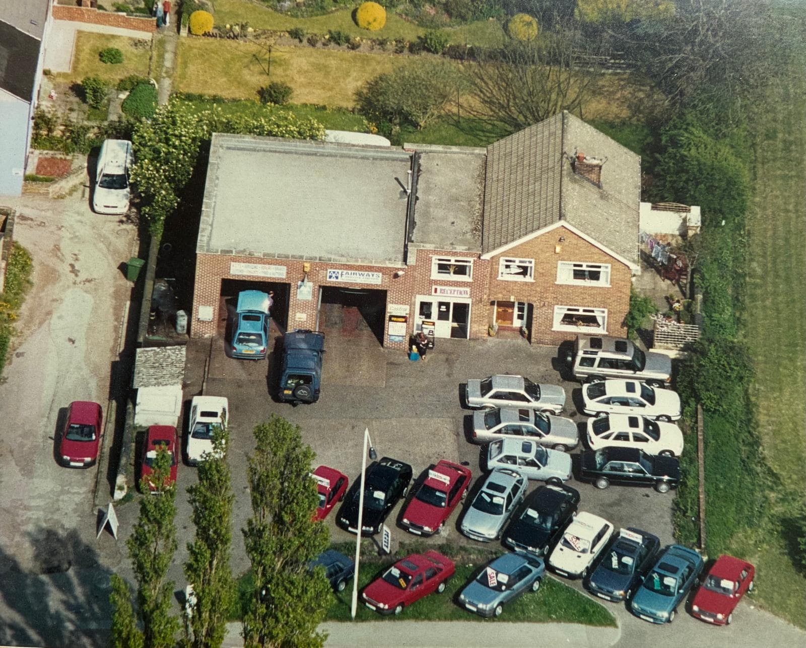 Aerial view of Fairways in the early 2000s with a full forecourt of cars